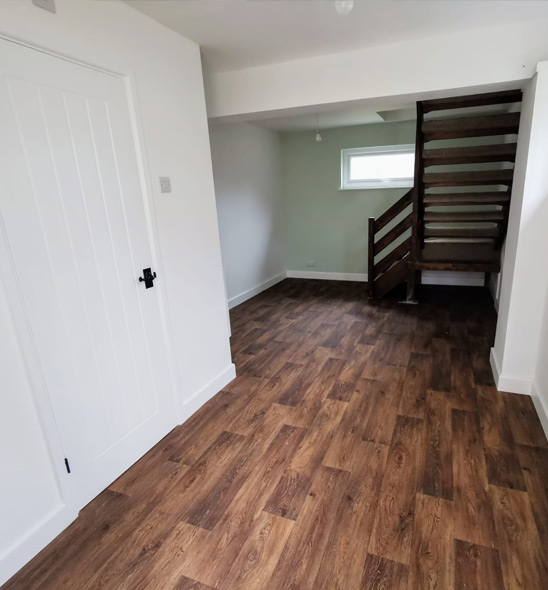 Loft conversion staircase and finished room